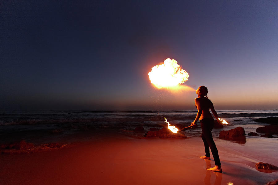 Woman Breathing Fire On Beach Photograph by Peathegee Inc
