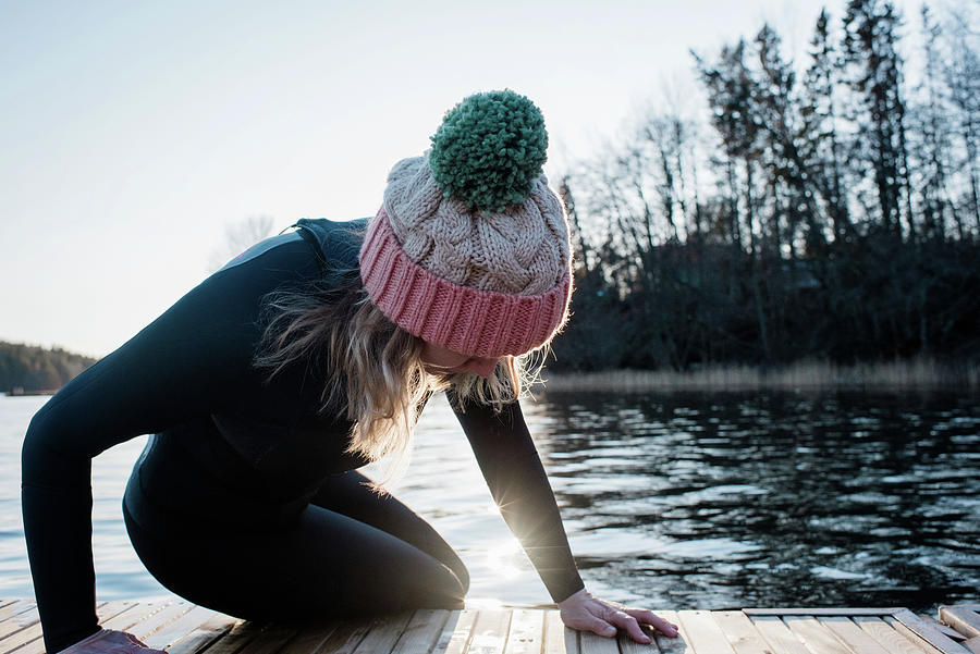 Woman Climbing Out Of The Water From Cold Water Ice Swimming In Sweden ...