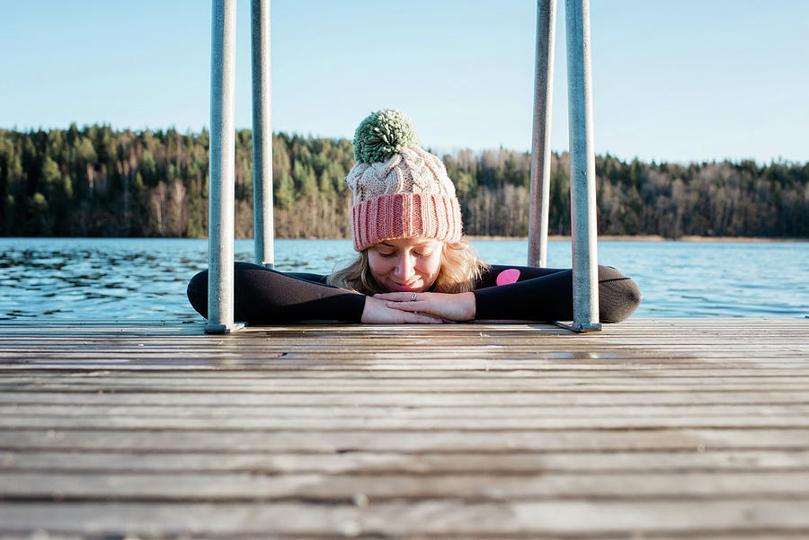 Summer Photograph - Woman Cold Water Ice Swimming In The Sea In Sweden Leaning On A Pier by Cavan Images