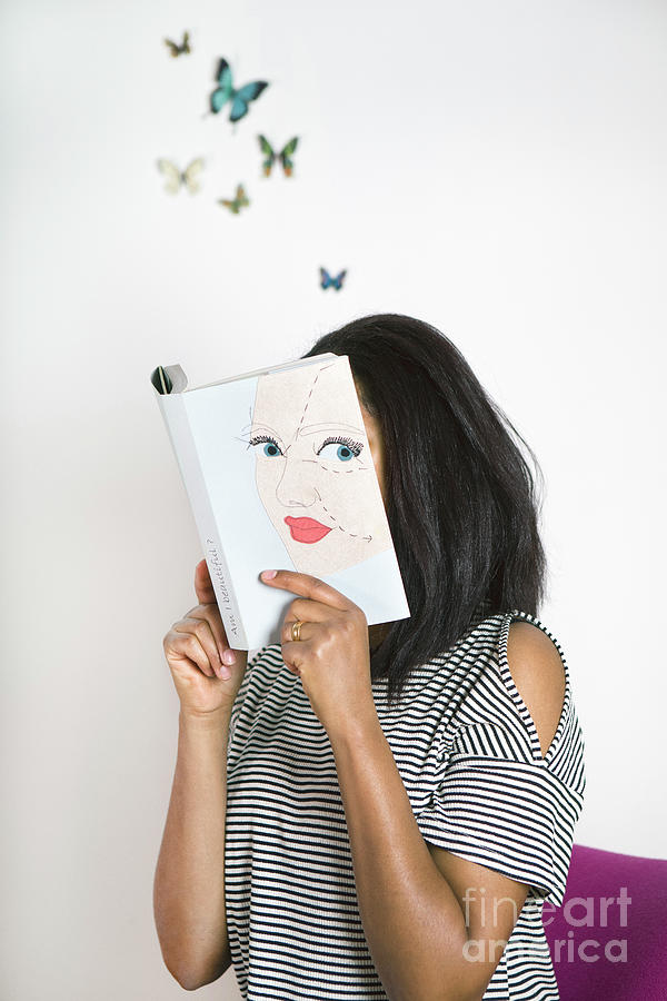 Woman Covering Face With Book, Reading Photograph by Westend61