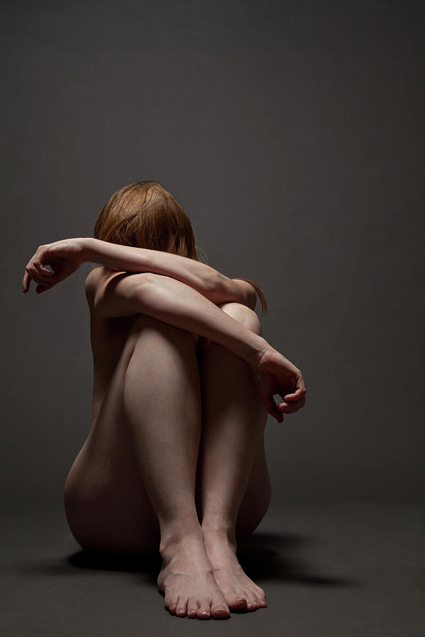 Woman Crouched On Floor Photograph by Claudia Burlotti