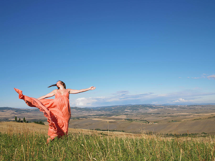 Woman Dancing In Field Photograph by Aurelie And Morgan David De Lossy