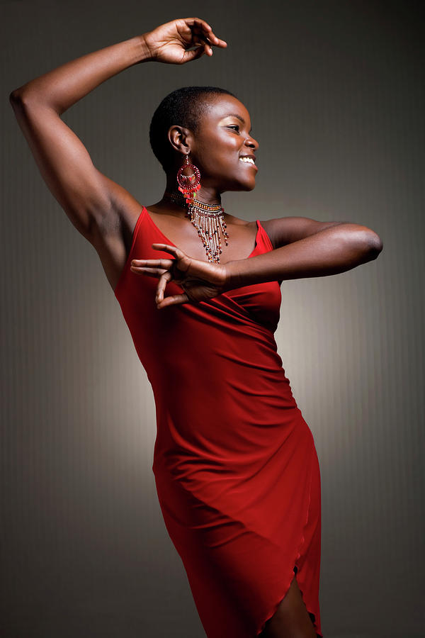 Woman Dancing In Red Dress Photograph by Noah Clayton