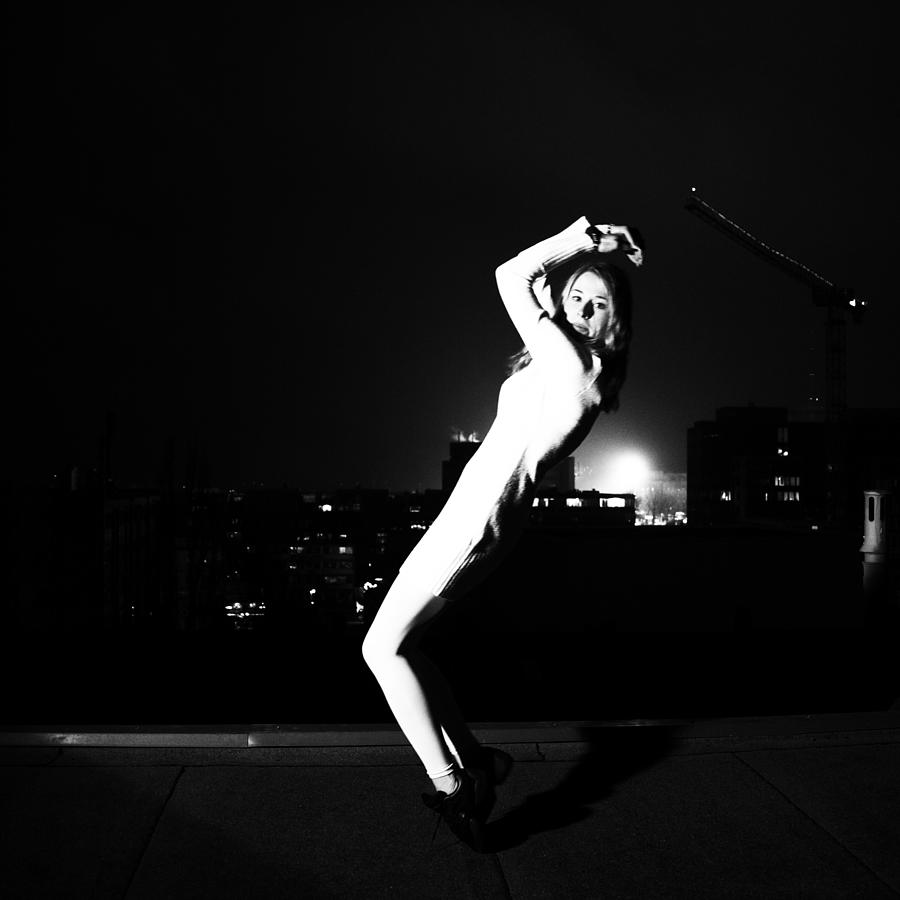 Woman Dancing With Citylights In Dark Photograph by Photo By Dictus @ Getty Images