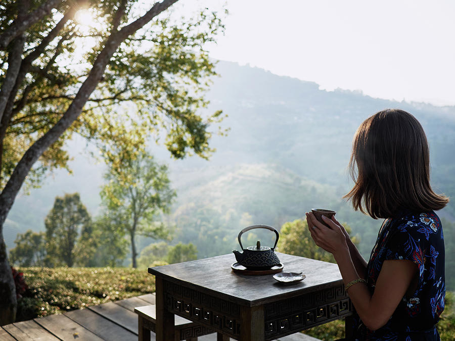 Woman Drinking Tea In Garden Photograph by Cavan Images - Fine Art America