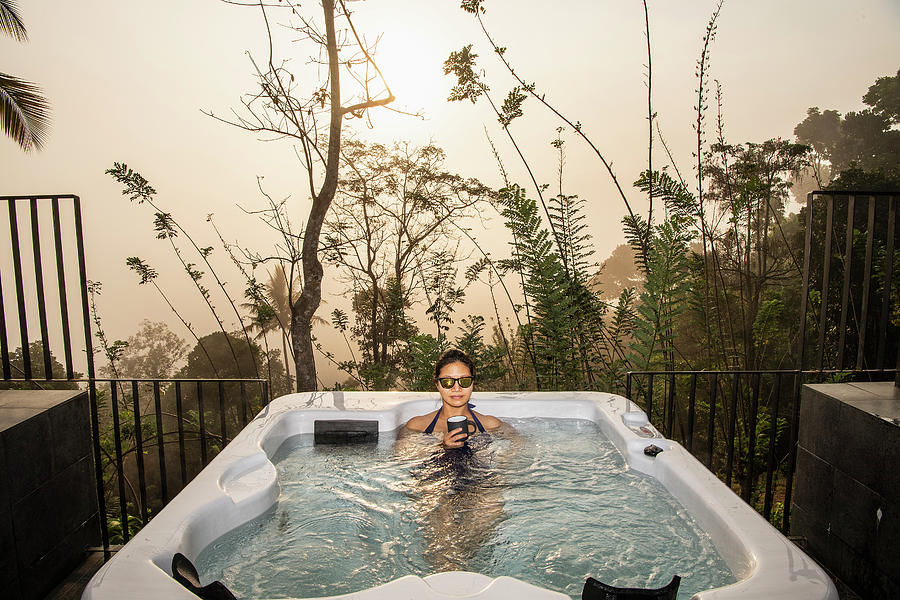 Woman Enjoying A Bath In A Hot Tub In The Sri Lankan ...