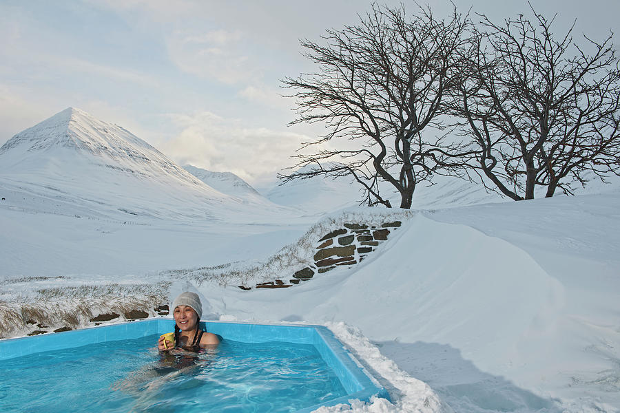 Winter Photograph - Woman Enjoying Hot Tub At Ski Lodge In Iceland by Cavan Images