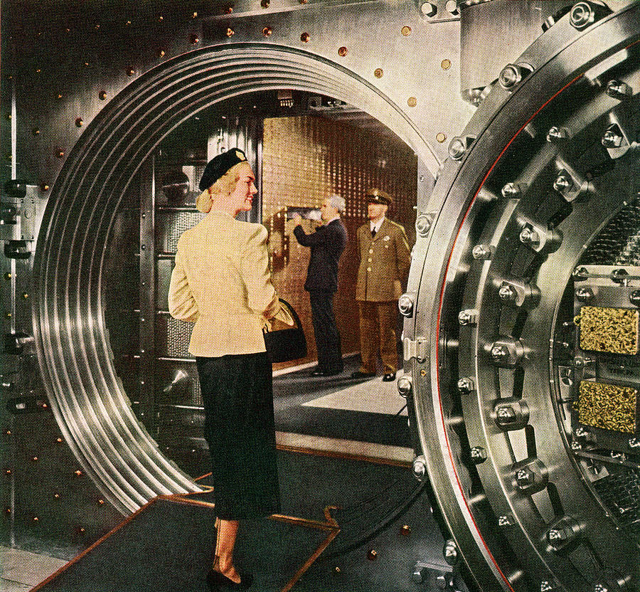 Woman Entering Bank Vault Photograph by Graphicaartis