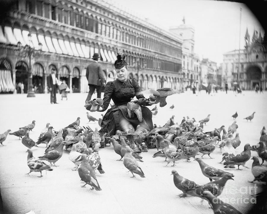 Woman Feeding Pigeons Photograph by Bettmann