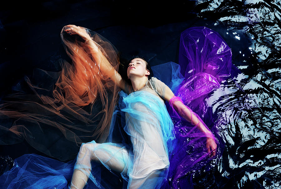 Woman Floating In Water And Colored Photograph By Tara Moore