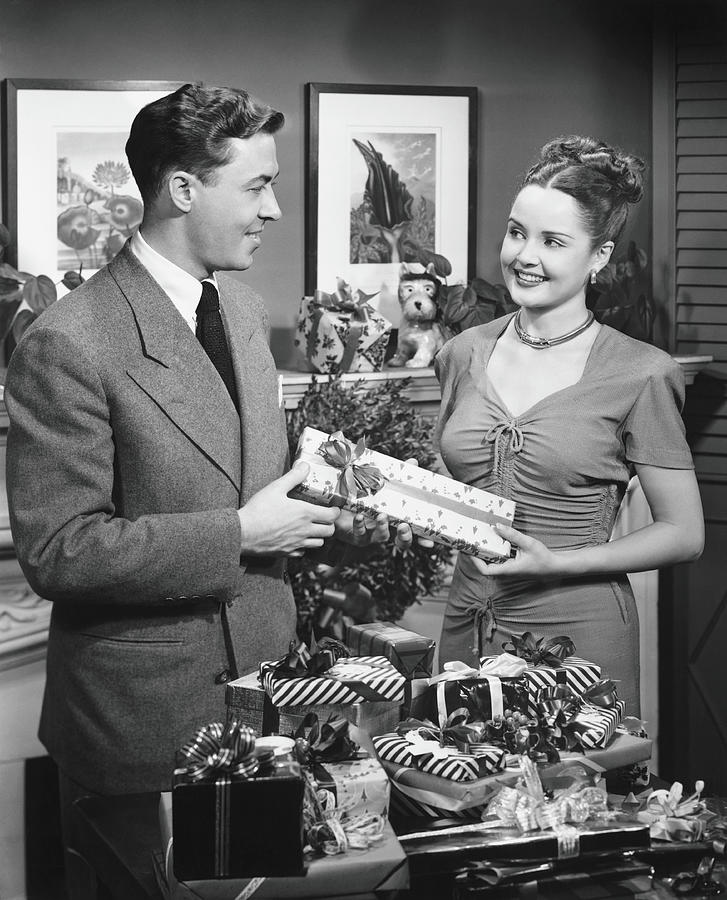 Black And White Photograph - Woman Giving Gift To Man, B&w by George Marks