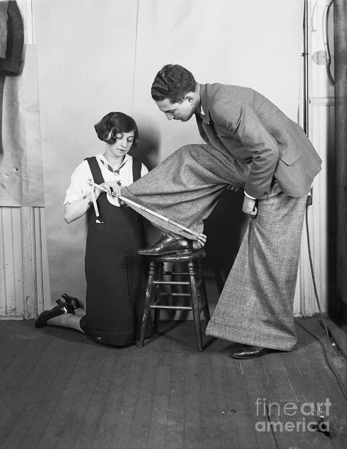 Woman Has Wide-cuffs Of Trousers Measure Photograph by Bettmann