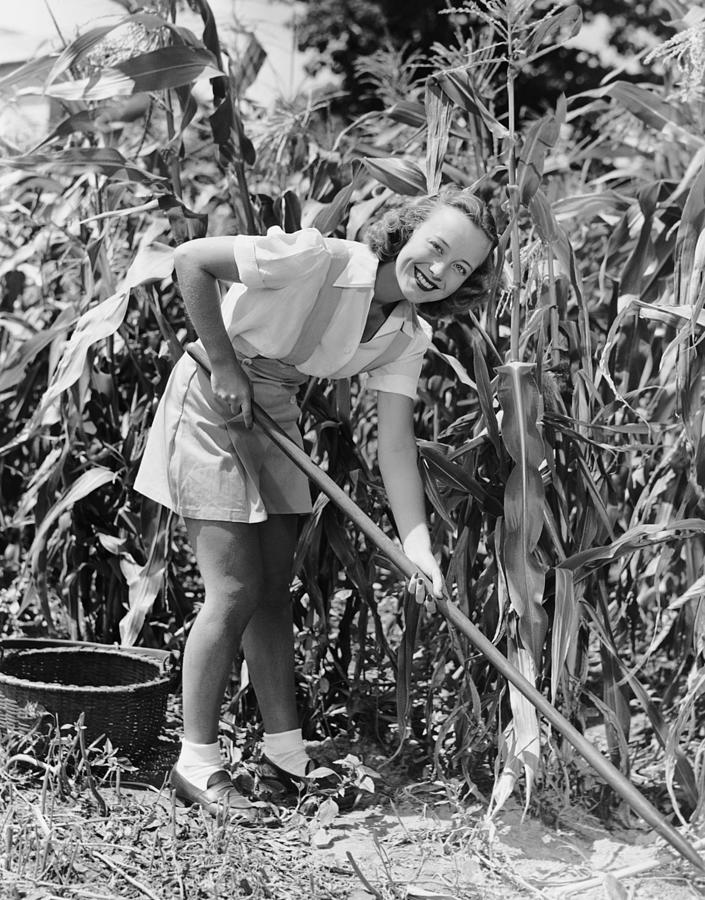 Woman Hoeing In Field Of Corn Photograph by George Marks