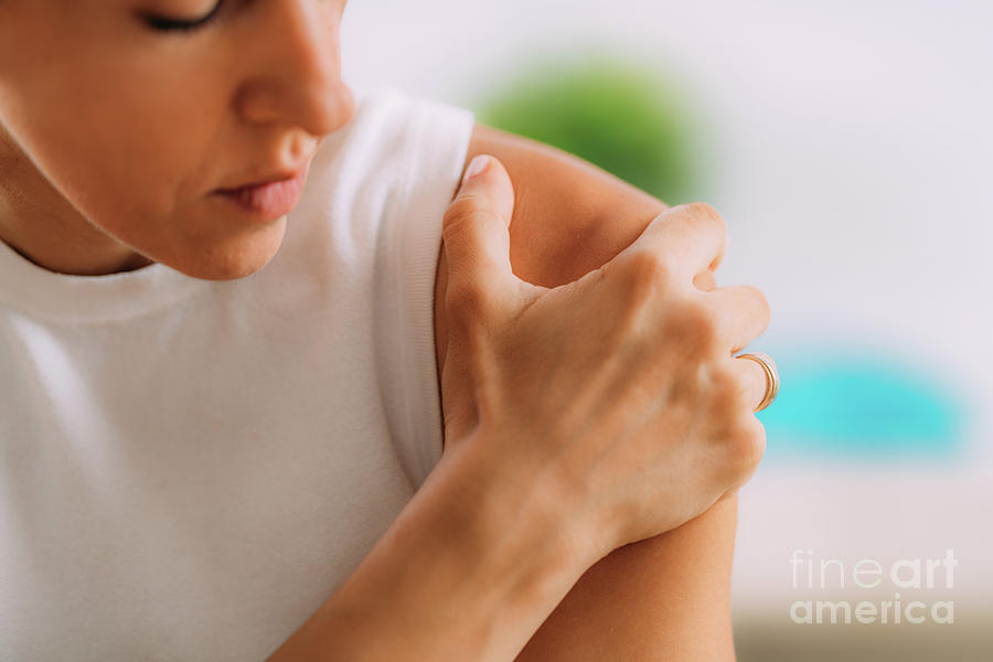 Woman Holding Onto Painful Shoulder Photograph by Microgen Images/science Photo Library