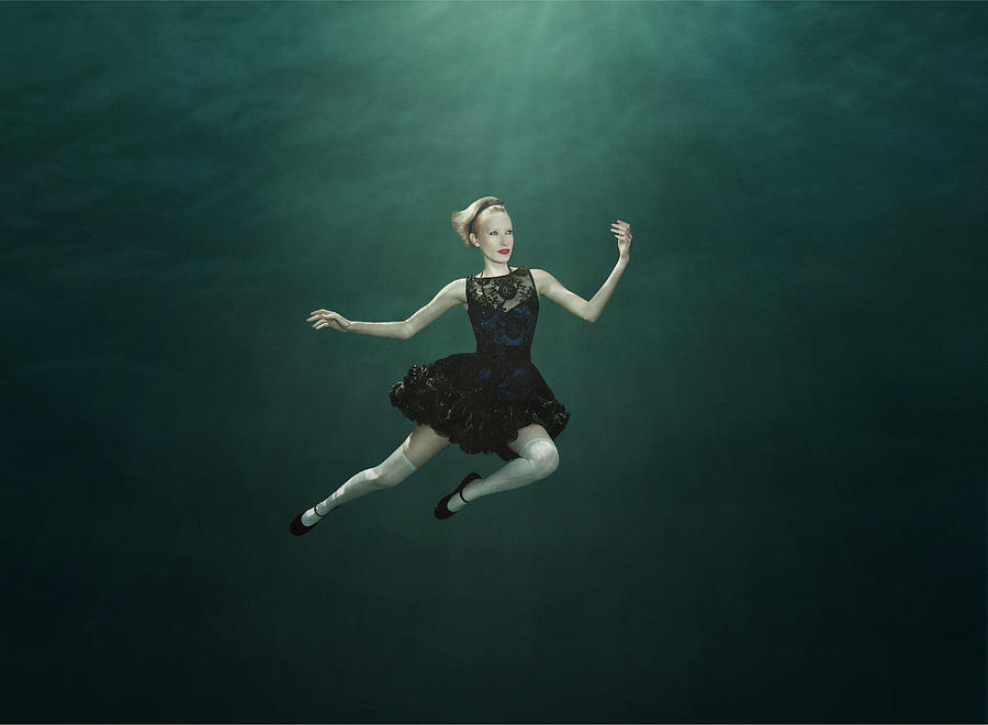 Woman In Black Dress Floating Underwater Photograph by Rebecca Handler