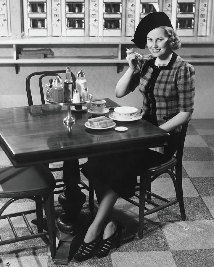 Woman In Fancy Hat Eating Breakfast In Photograph by George Marks