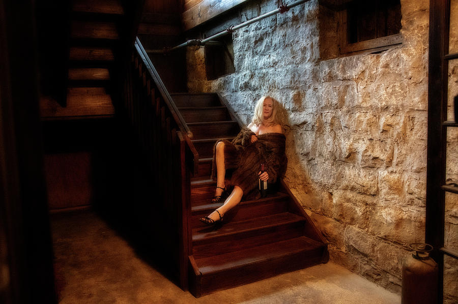 Woman in fur drinking on steps Photograph by Dan Friend