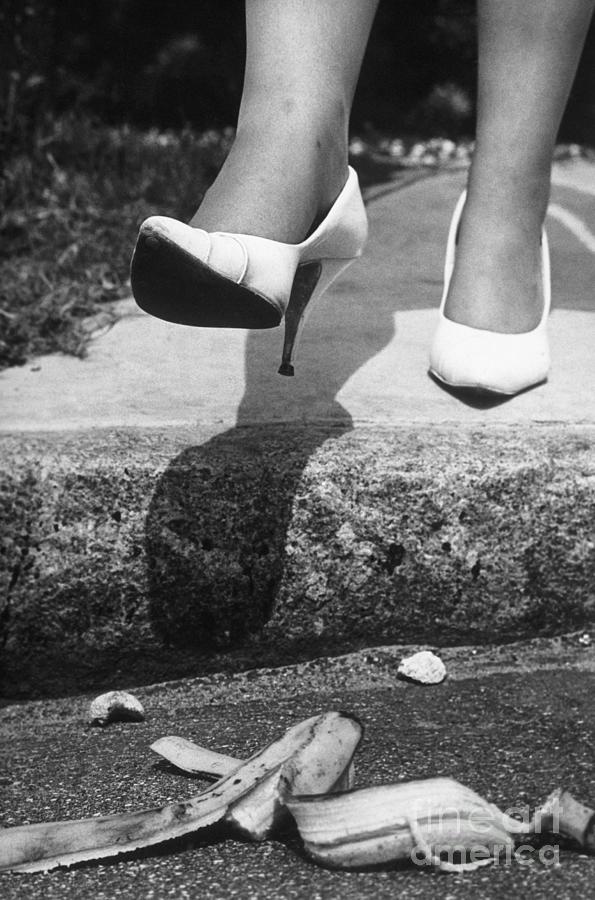Woman In Heels Stepping On Banana Peel Photograph by Bettmann
