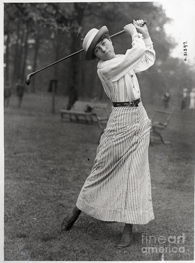 Woman In Middle Of Golf Swing Photograph by Bettmann