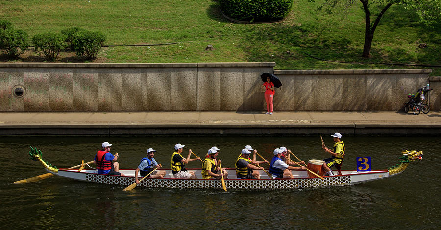 Boat Photograph - Woman in Orange Watches Dragon Boat Race by Beth Partin