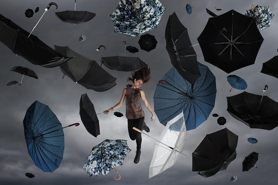 Woman In The Sky With Umbrellas Raining Photograph by Nisian Hughes
