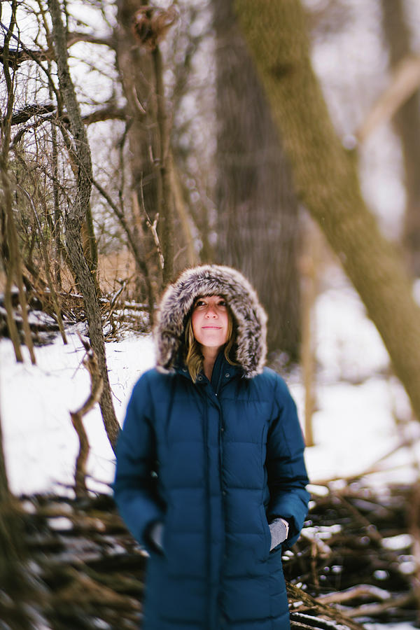 Winter Photograph - Woman In Warm Fur Lined Hood Coat In Snow Forest by Cavan Images / Anna Rasmussen Photographs