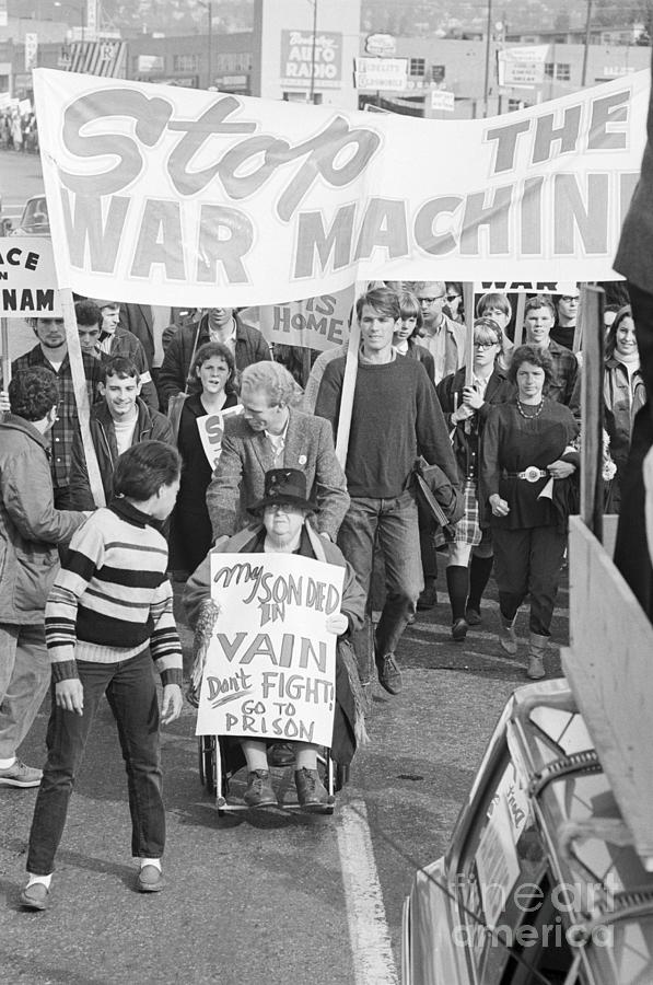 Woman In Wheelchair Holds Anti-war Sign Photograph by Bettmann