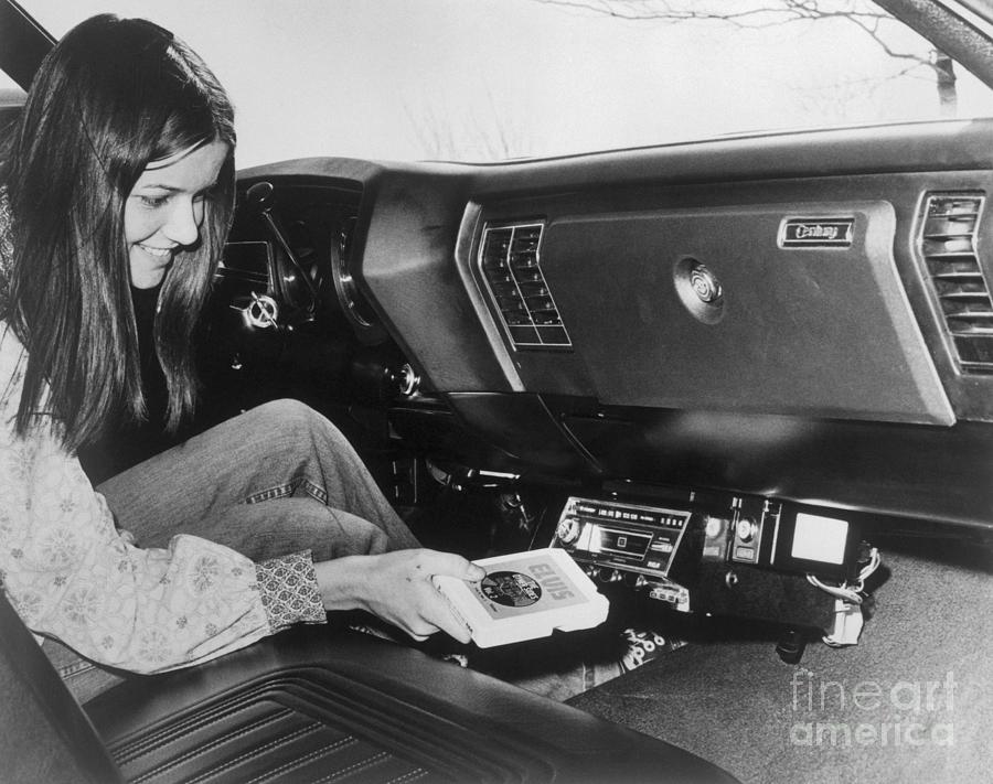 Woman Inserting Eight-track Tape In Car Photograph by Bettmann