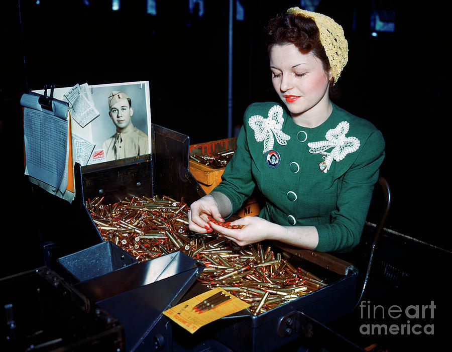 Woman Inspecting Bullets Photograph by Bettmann