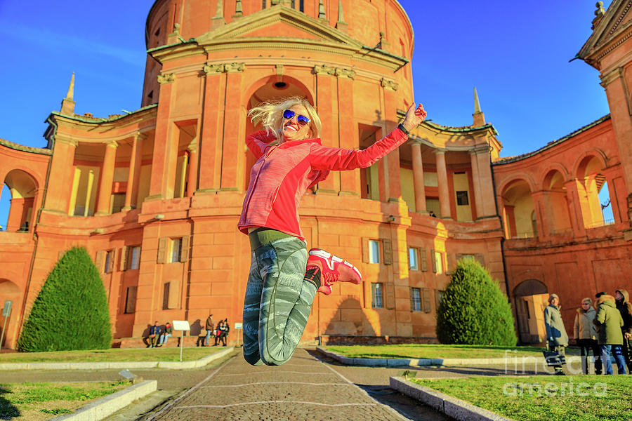 Woman jumping at San Luca Photograph by Benny Marty