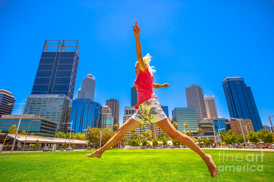 Woman jumping in Perth Photograph by Benny Marty