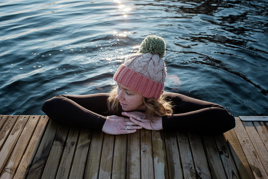 Woman Leaning On A Pier Whilst In The Water Cold Water Swimming ...