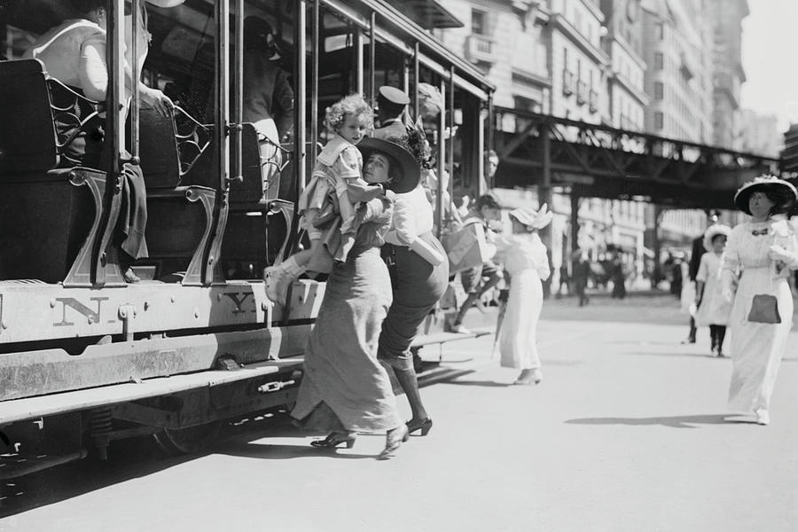 Woman lifts child off of an open sided Trolley Car on New Yorks Broadway Painting by 