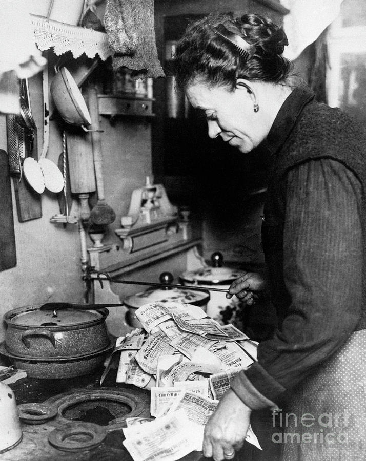 Woman Lighting Fire With German Money Photograph by Bettmann