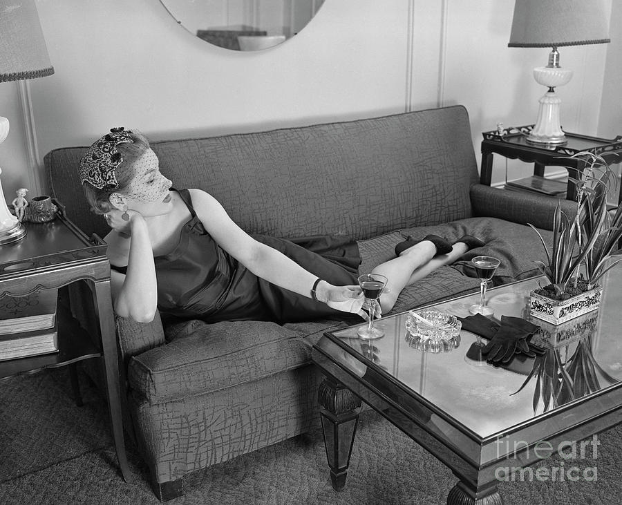 Woman Lounging On Sofa Photograph by Bettmann