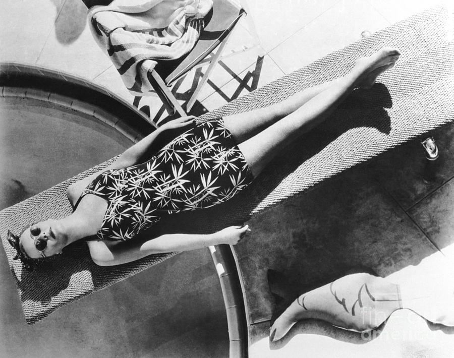 Woman Lying On Diving Board Photograph by Bettmann
