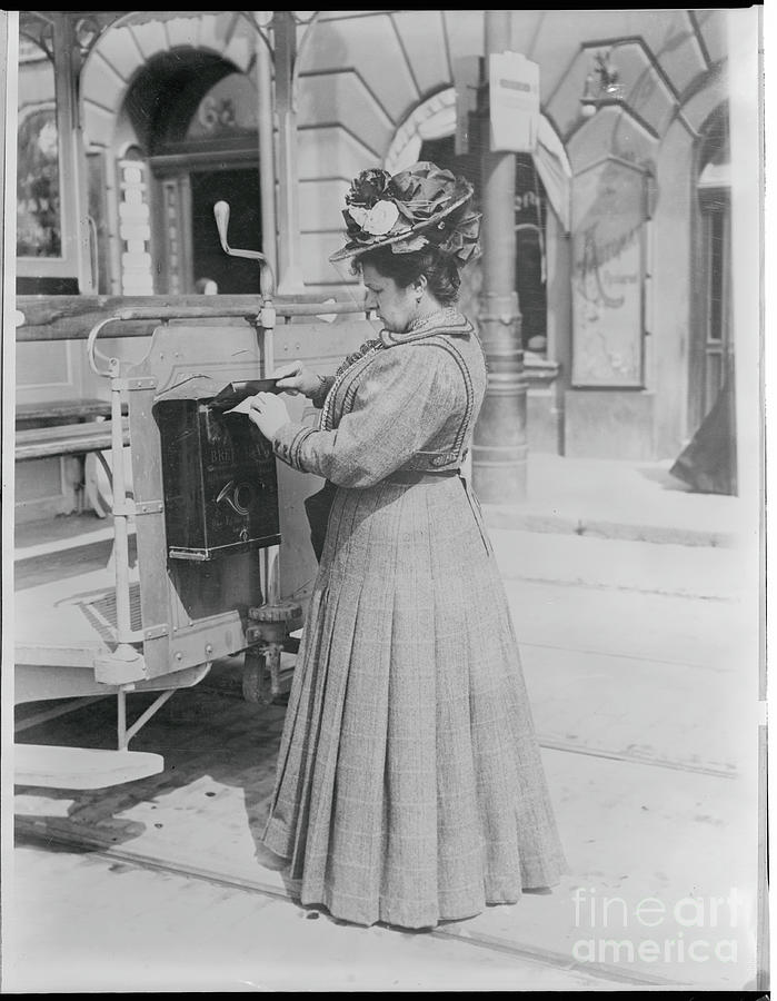 Woman Mailing Letter In Mailbox Photograph by Bettmann