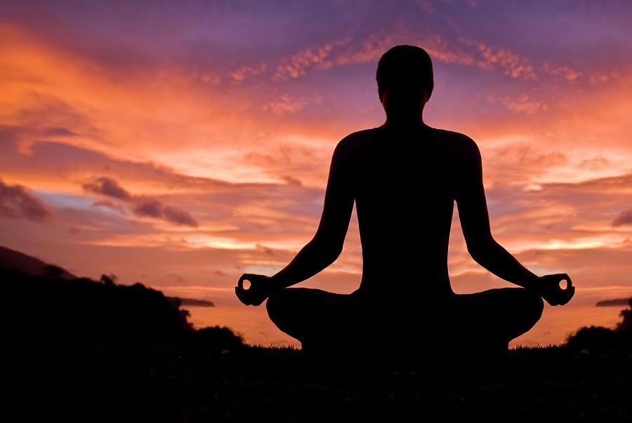 Woman Meditating In Sunset Photograph by Aleaimage