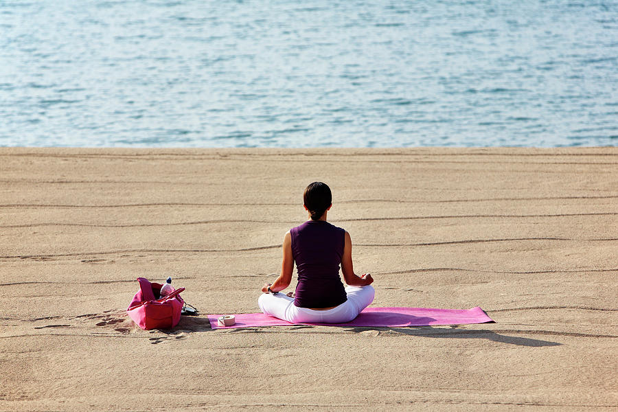 Woman Meditating On The Beach Digital Art by Richard Taylor