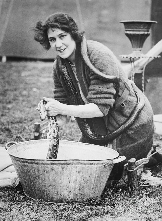 Woman Milk Bathing Snakes Photograph by Bettmann