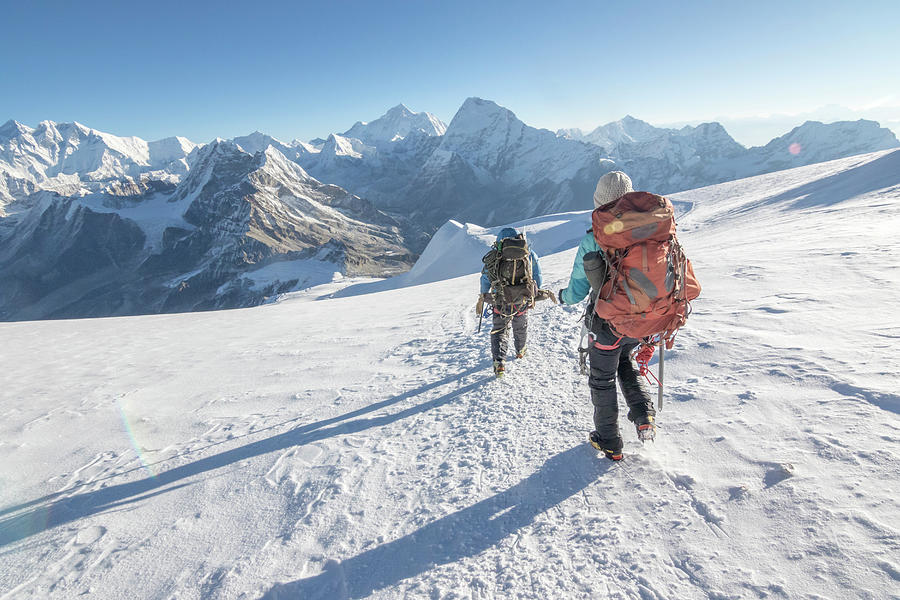 Woman Mountaineer & Cimbing Sirdar Descend A Glacier, Everest On Left 