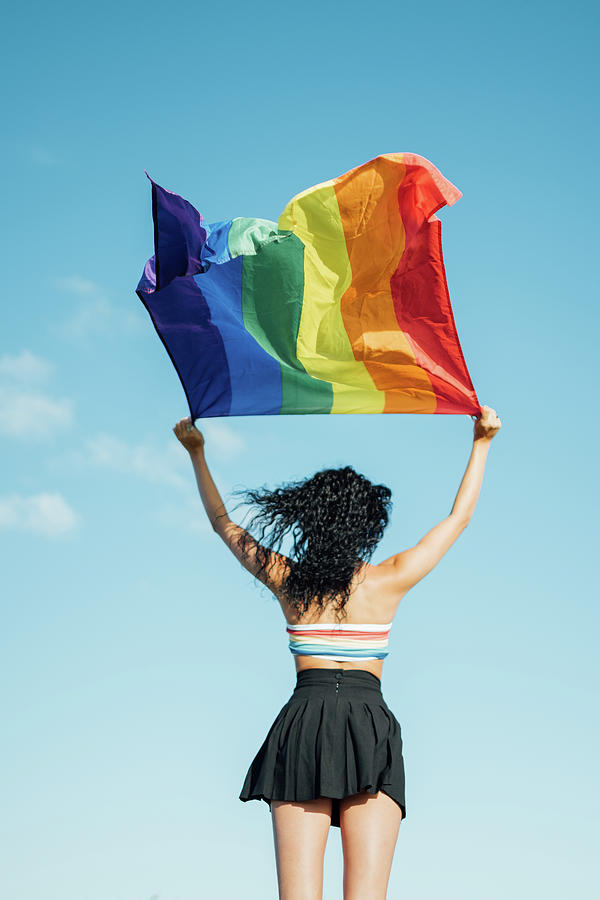 Woman On Her Back With Open Arms Waving An Lgbt Flag Photograph By