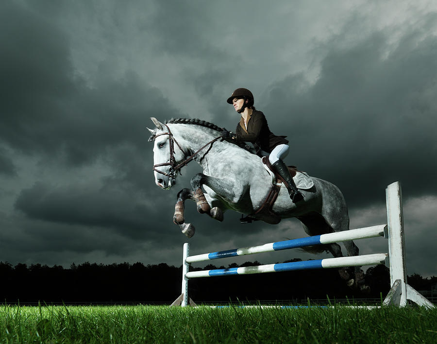 Woman On Horse Jumping Photograph by Henrik Sorensen