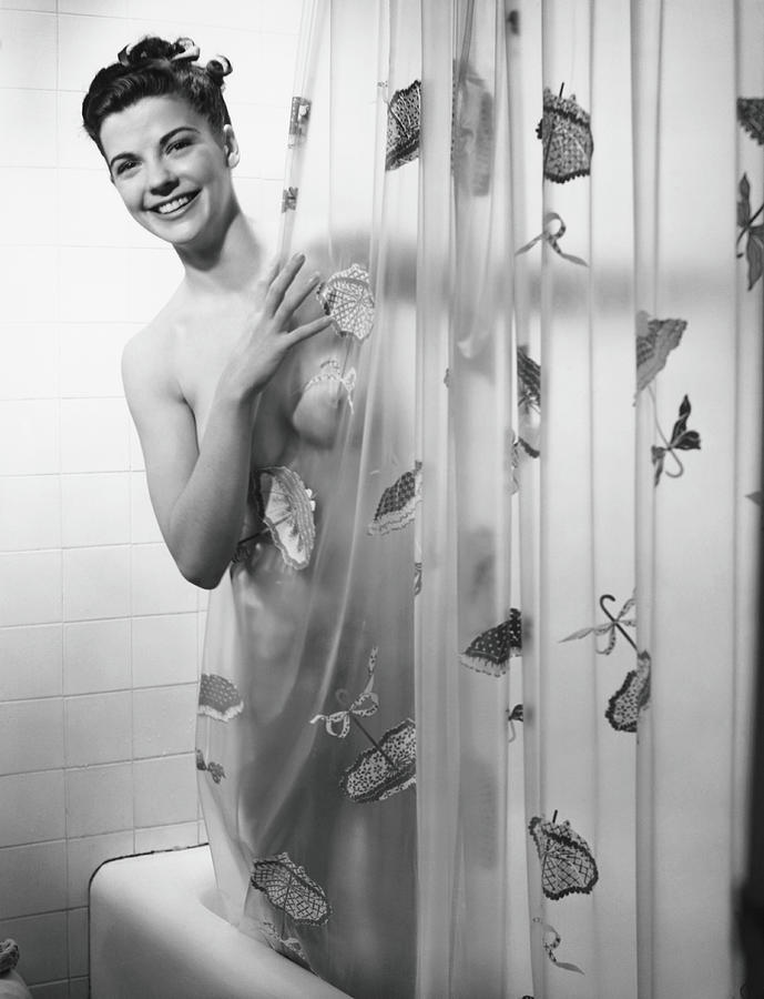 Woman Peering Through Shower Curtain Photograph by George Marks