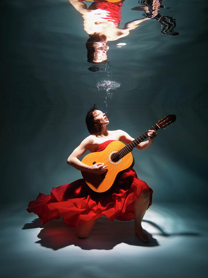 Woman Playing Guitar Underwater Photograph by Henrik Sorensen