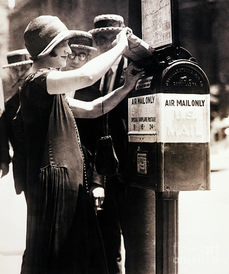 Woman Putting Package Into First Airmail Photograph by Bettmann