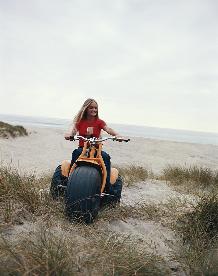 Woman Riding Bike On Beach Photograph by Tom Kelley Archive