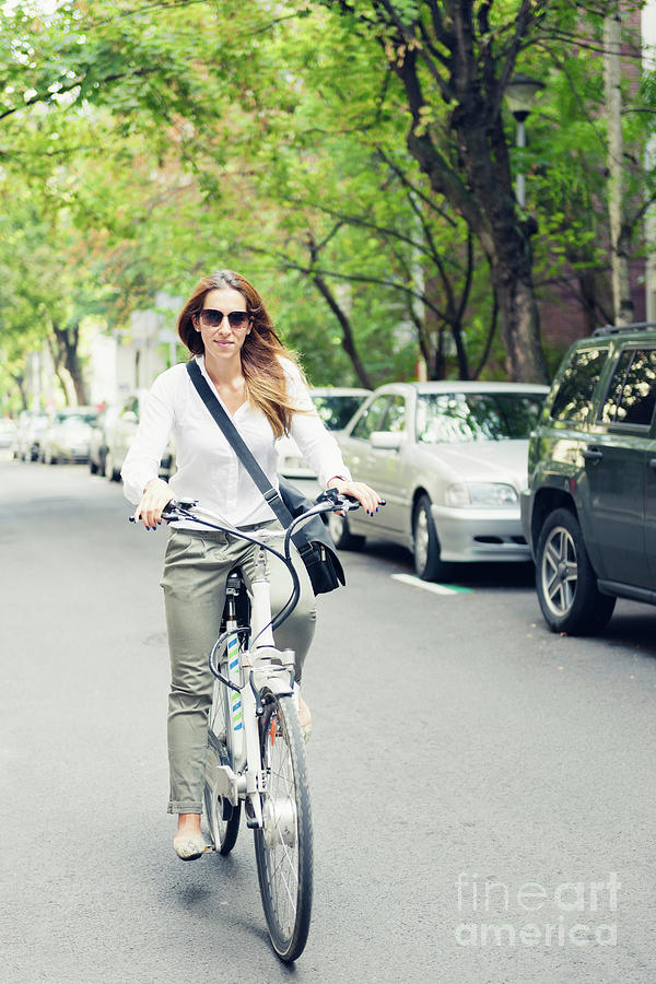 Woman Riding Electric Bike Photograph by Microgen Images/science Photo Library