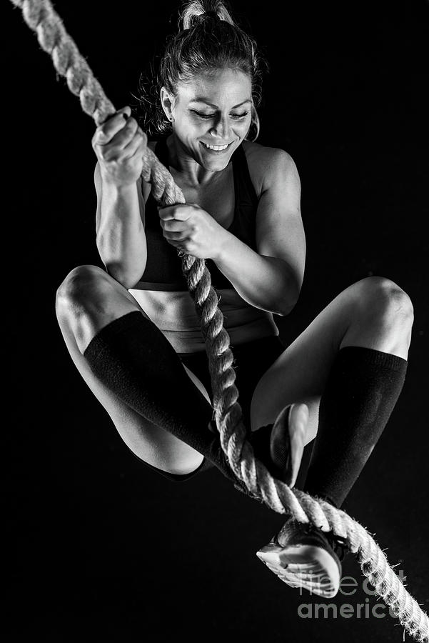 Woman Rope Climbing Photograph by Microgen Images/science Photo Library