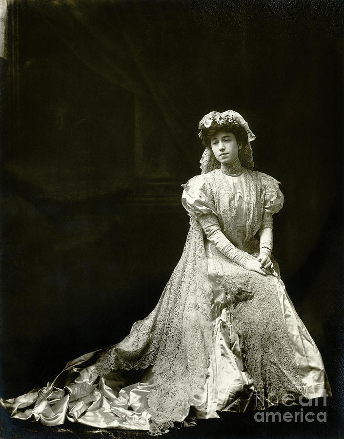 Woman Seated In Satin And Lace Wedding Photograph by Bettmann
